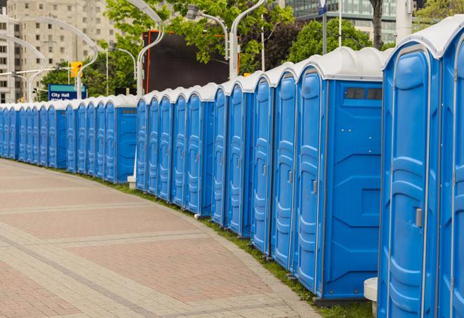 portable restrooms stationed outside of a high-profile event, with attendants available for assistance in Churchville